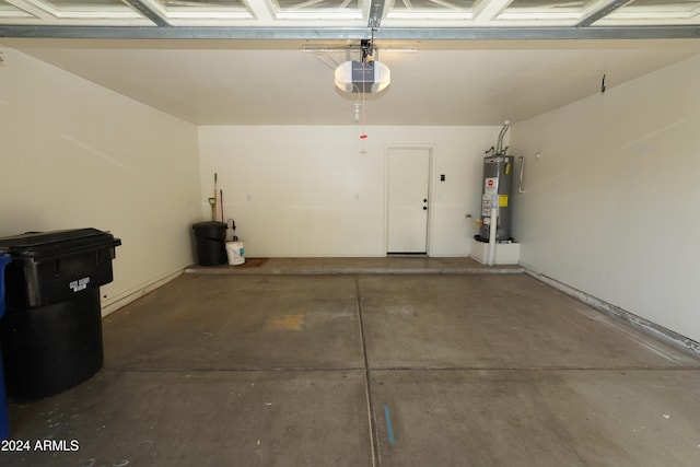 garage with a garage door opener and gas water heater