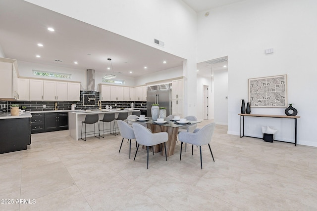 707 E Ocotillo Rd, Phoenix, AZ 85014 - dining space featuring recessed lighting and a towering ceiling