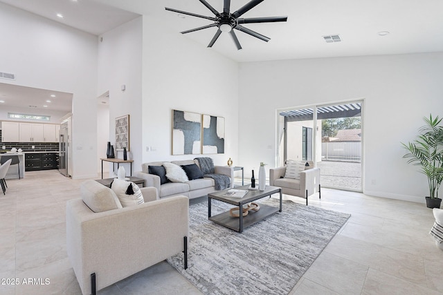 707 E Ocotillo Rd, Phoenix, AZ 85014 - living room with high vaulted ceiling, recessed lighting, a ceiling fan, and baseboards