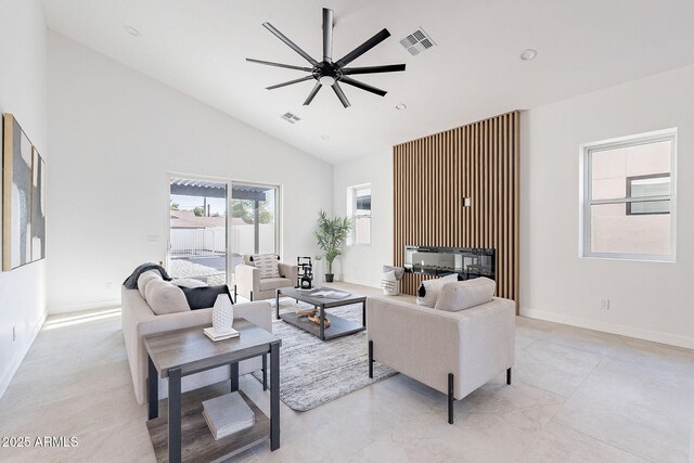 707 E Ocotillo Rd, Phoenix, AZ 85014 - living room featuring high vaulted ceiling, ceiling fan, and baseboards