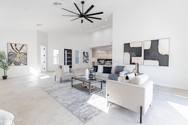 707 E Ocotillo Rd, Phoenix, AZ 85014 - living room with ceiling fan, a towering ceiling, recessed lighting, and baseboards