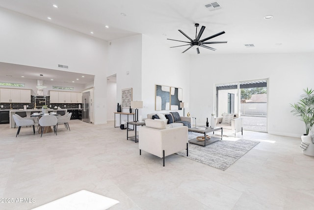 707 E Ocotillo Rd, Phoenix, AZ 85014 - living room featuring high vaulted ceiling, recessed lighting, ceiling fan, and baseboards
