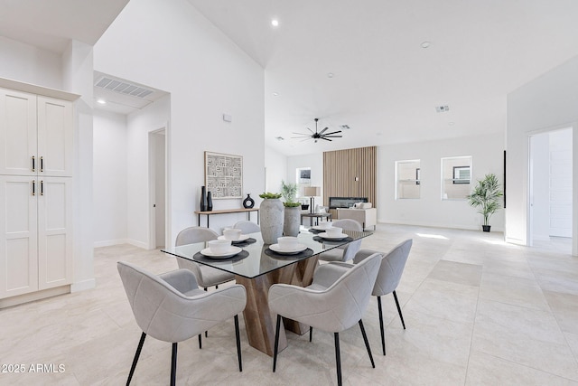 707 E Ocotillo Rd, Phoenix, AZ 85014 - dining area with light tile patterned flooring, ceiling fan, recessed lighting, baseboards, and lofted ceiling