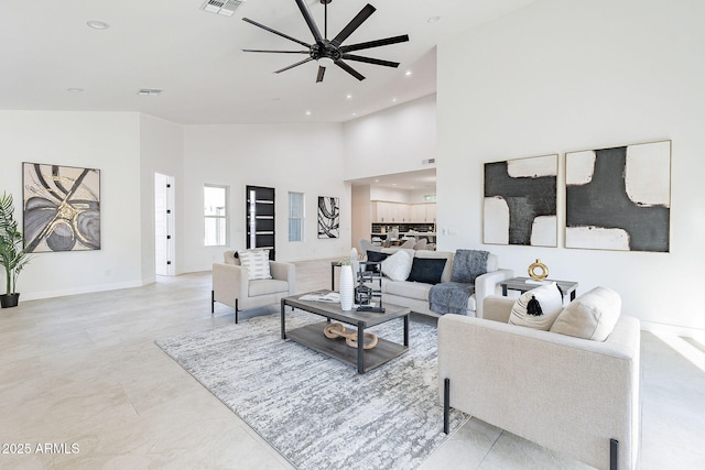 707 E Ocotillo Rd, Phoenix, AZ 85014 - living room with a ceiling fan, a towering ceiling, recessed lighting, and baseboards