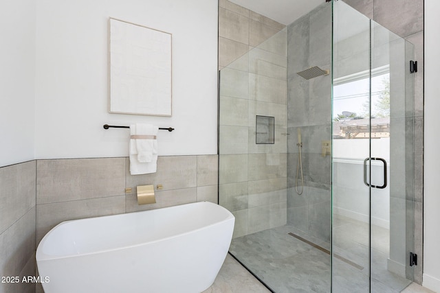 707 E Ocotillo Rd, Phoenix, AZ 85014 - bathroom with a shower stall, a soaking tub, and tile walls