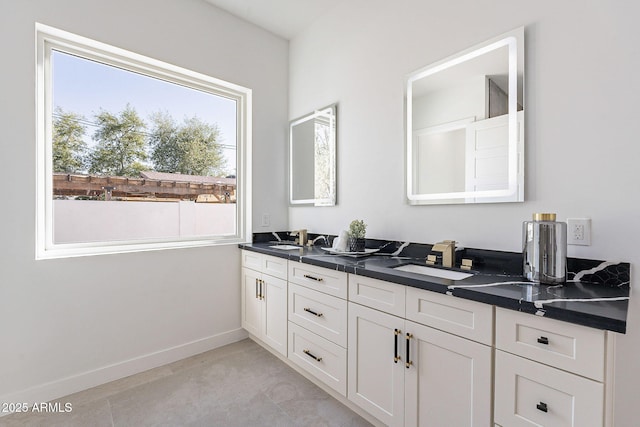 707 E Ocotillo Rd, Phoenix, AZ 85014 - full bathroom with double vanity and baseboards