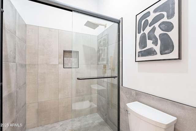 707 E Ocotillo Rd, Phoenix, AZ 85014 - bathroom with toilet, a stall shower, and tile walls