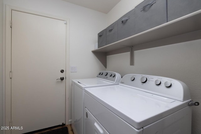 laundry room with washing machine and clothes dryer