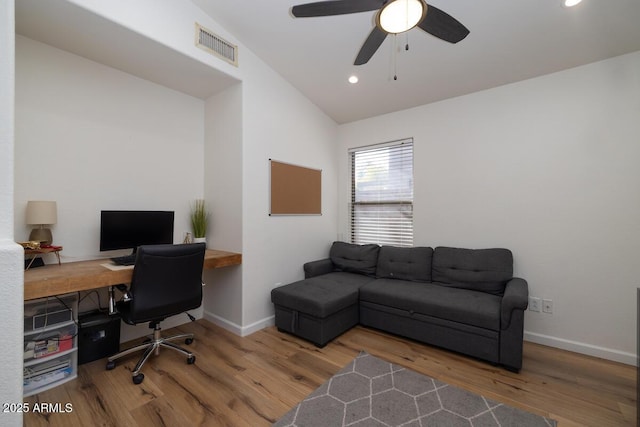 office space featuring lofted ceiling, wood-type flooring, and ceiling fan