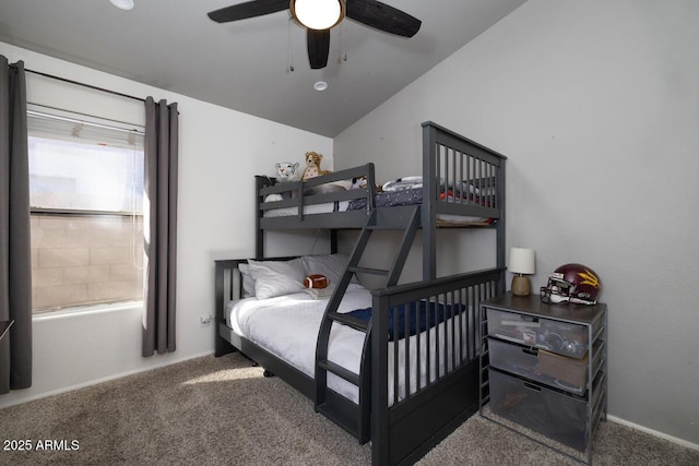 carpeted bedroom with vaulted ceiling and ceiling fan