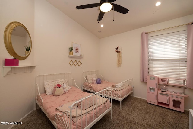 bedroom featuring lofted ceiling, dark carpet, and ceiling fan