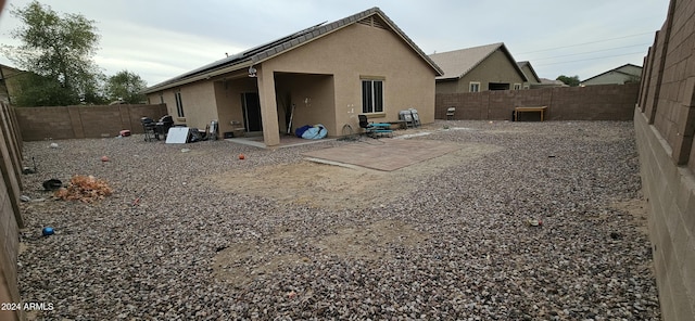 25422 W Maldonado Ct, Buckeye, AZ 85326 - back of property with stucco siding, a fenced backyard, and a patio