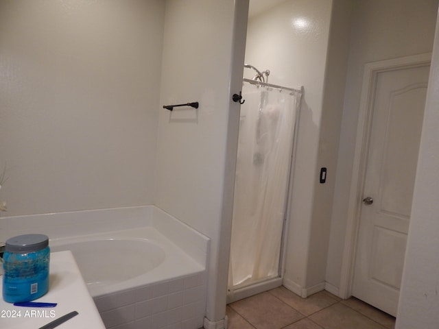 bathroom featuring tile patterned floors and independent shower and bath