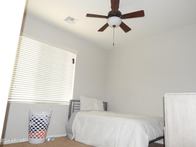 carpeted bedroom with ceiling fan