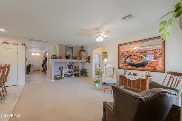 living room featuring ceiling fan and light tile patterned flooring