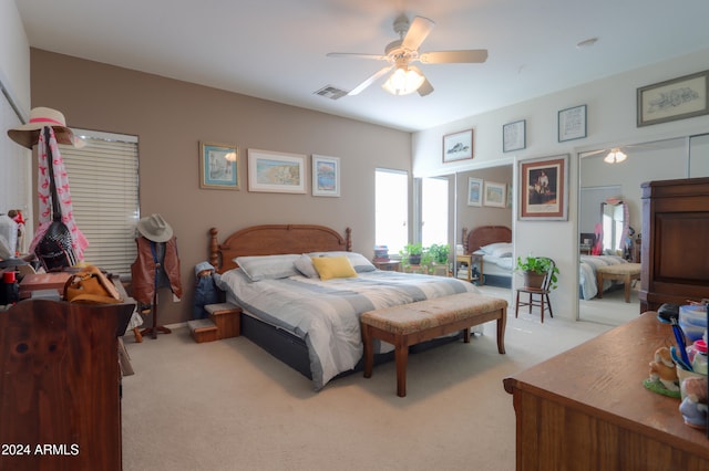 carpeted bedroom featuring ceiling fan