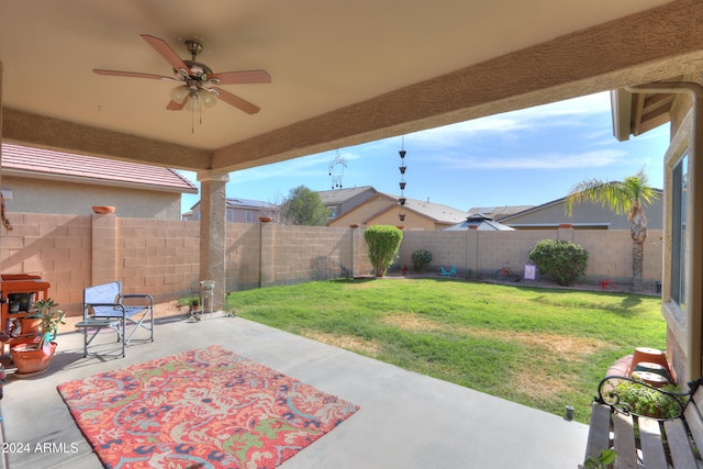 view of yard featuring ceiling fan and a patio area