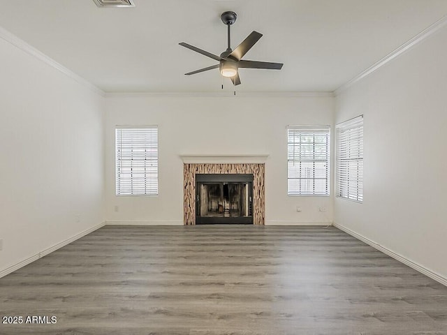 13064 N 100th Pl, Scottsdale, AZ 85260 - unfurnished living room with ornamental molding, healthy amount of natural light, ceiling fan, and wood finished floors