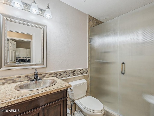 13064 N 100th Pl, Scottsdale, AZ 85260 - full bath with tile walls, a stall shower, vanity, and toilet