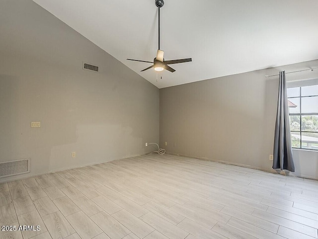 13064 N 100th Pl, Scottsdale, AZ 85260 - empty room with ceiling fan, vaulted ceiling, and light wood-style flooring