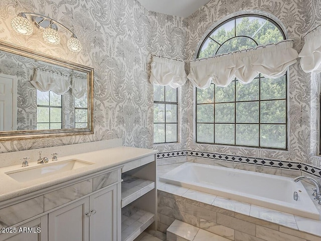 13064 N 100th Pl, Scottsdale, AZ 85260 - bathroom with healthy amount of natural light, wallpapered walls, vanity, and a garden tub