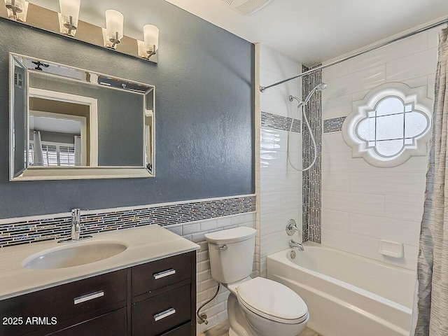 13064 N 100th Pl, Scottsdale, AZ 85260 - bathroom featuring shower / tub combo with curtain, toilet, vanity, tile walls, and plenty of natural light