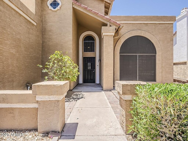 13064 N 100th Pl, Scottsdale, AZ 85260 - doorway to property with stucco siding