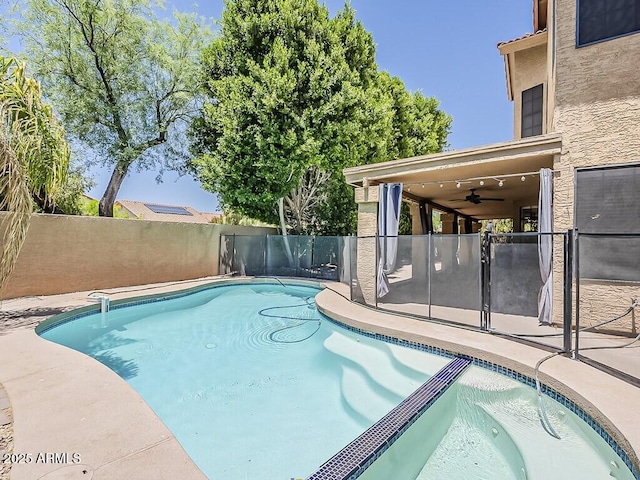 13064 N 100th Pl, Scottsdale, AZ 85260 - view of swimming pool with ceiling fan, a fenced backyard, a patio, and a pool with connected hot tub
