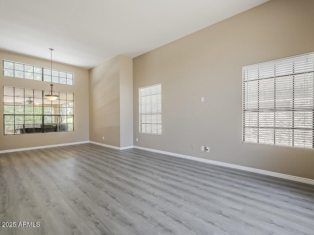13064 N 100th Pl, Scottsdale, AZ 85260 - unfurnished room featuring wood finished floors and baseboards