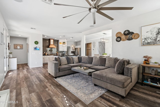 20518 W White Rock Rd, Buckeye, AZ 85396 - living room featuring dark wood-style floors, ceiling fan, recessed lighting, and a chandelier