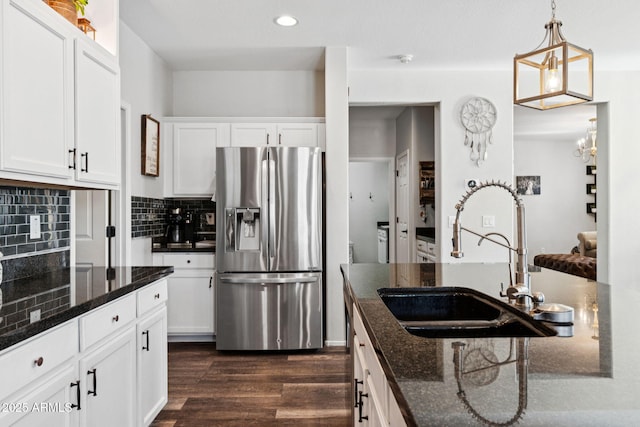 20518 W White Rock Rd, Buckeye, AZ 85396 - kitchen featuring stainless steel fridge, dark wood-style flooring, tasteful backsplash, white cabinetry, and recessed lighting
