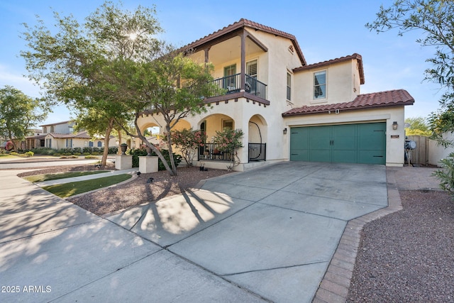 20518 W White Rock Rd, Buckeye, AZ 85396 - mediterranean / spanish house featuring a balcony, a tiled roof, driveway, stucco siding, and covered porch