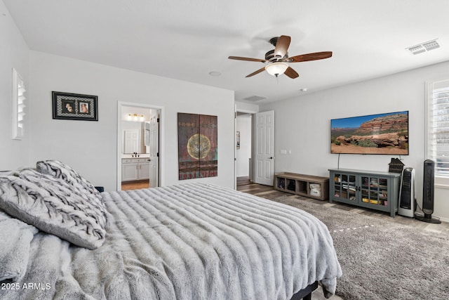 20518 W White Rock Rd, Buckeye, AZ 85396 - bedroom with wood finished floors, ensuite bath, and ceiling fan