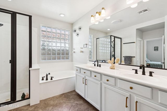 20518 W White Rock Rd, Buckeye, AZ 85396 - ensuite bathroom featuring a shower stall, double vanity, a bath, and tile patterned flooring