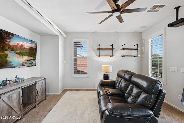 20518 W White Rock Rd, Buckeye, AZ 85396 - living area with light carpet, a ceiling fan, and healthy amount of natural light