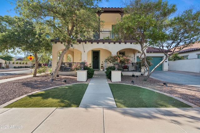 20518 W White Rock Rd, Buckeye, AZ 85396 - mediterranean / spanish house featuring stucco siding, a porch, a garage, and concrete driveway