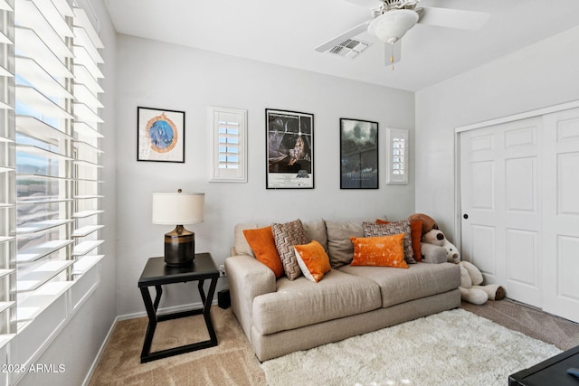 20518 W White Rock Rd, Buckeye, AZ 85396 - carpeted living area with a ceiling fan and baseboards