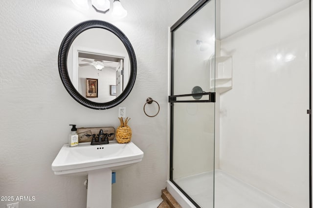 20518 W White Rock Rd, Buckeye, AZ 85396 - bathroom with a stall shower and a ceiling fan