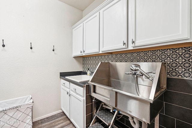 20518 W White Rock Rd, Buckeye, AZ 85396 - misc room with a sink and wood finished floors