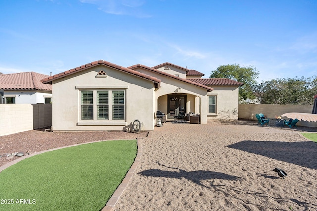 20518 W White Rock Rd, Buckeye, AZ 85396 - rear view of house with a fenced backyard, stucco siding, a patio area, and a tile roof