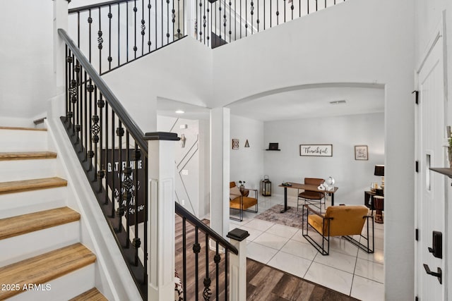 20518 W White Rock Rd, Buckeye, AZ 85396 - staircase featuring arched walkways and a high ceiling
