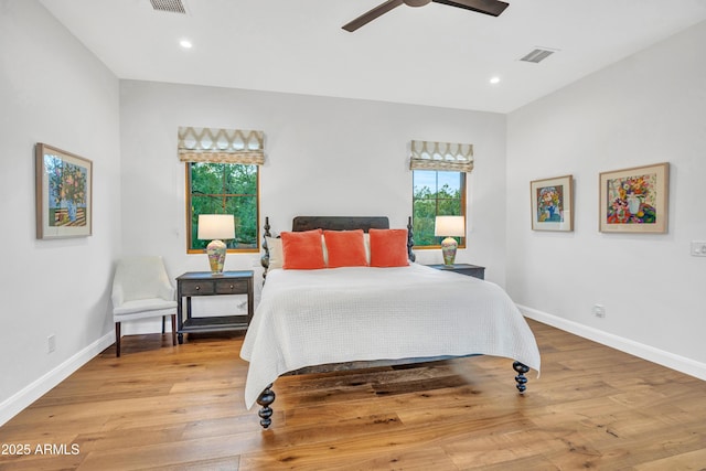 bedroom featuring light hardwood / wood-style flooring and ceiling fan