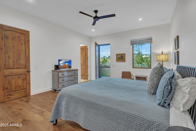 bedroom with access to exterior, light hardwood / wood-style floors, and ceiling fan