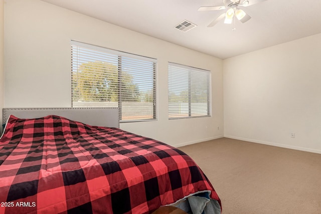 unfurnished bedroom with ceiling fan and carpet