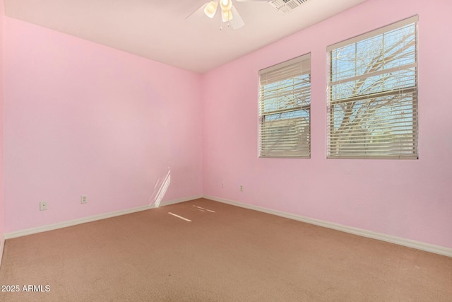 carpeted empty room with ceiling fan