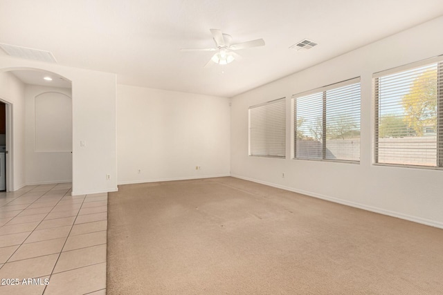 carpeted empty room with ceiling fan