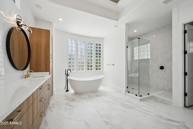 bathroom featuring baseboards, a stall shower, a freestanding tub, and recessed lighting