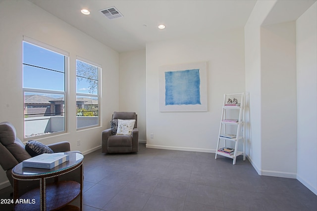 living area with dark tile flooring