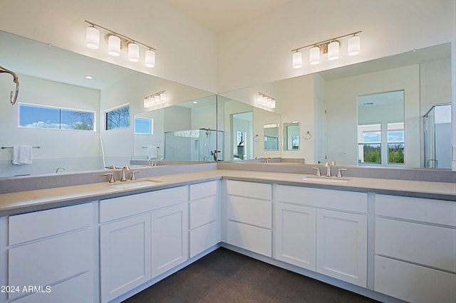 bathroom with double sink, tile flooring, and large vanity