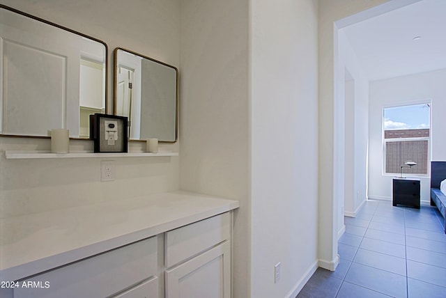 bathroom featuring tile floors and vanity